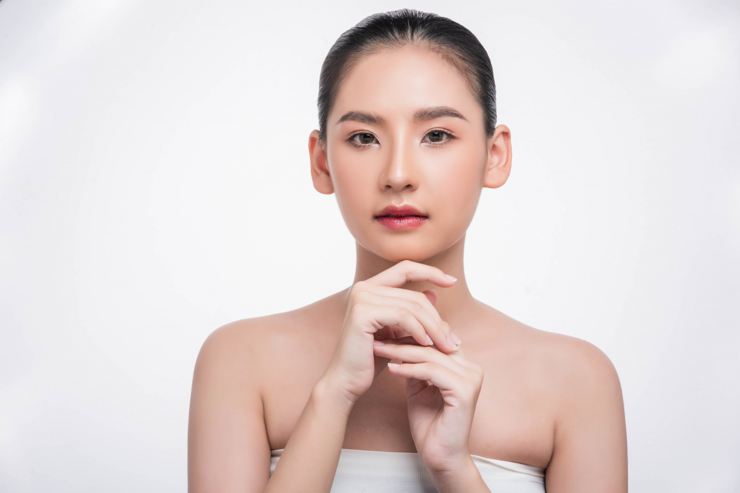 Korean Self-Care Routine 1 woman using finger touch chin