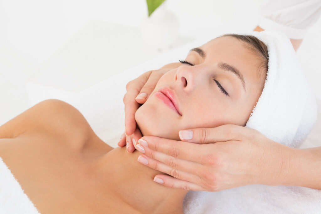 Coopers Plains' Mobile Elegance 2 close up attractive young woman receiving facial massage spa center
