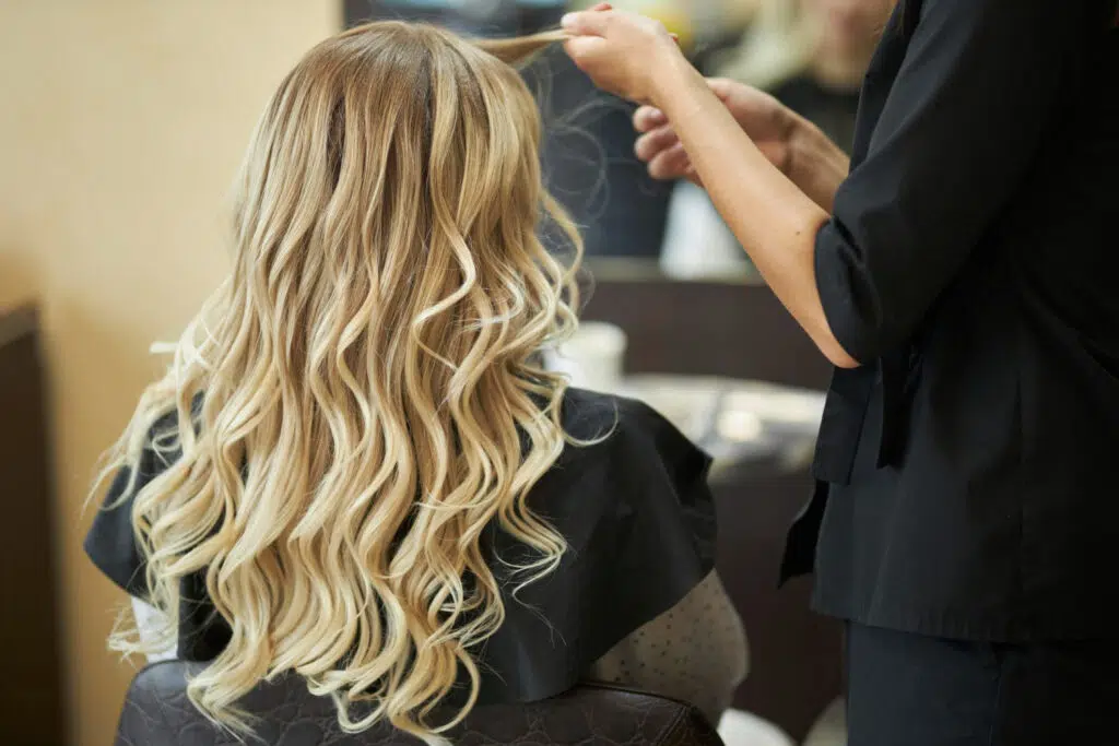 Mobile Elegance in Acacia Ridge 1 hairdresser beauty salon doing hair styling client with hair iron