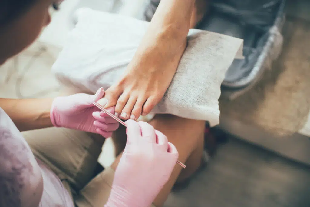 Mobile Beauty for Disabilities 2 hands making pedicure beauty salon female feet real picture