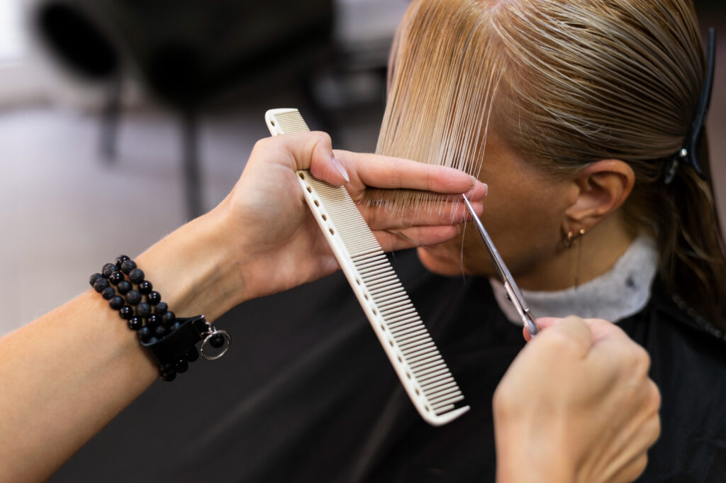 woman getting her hair cut beauty salon