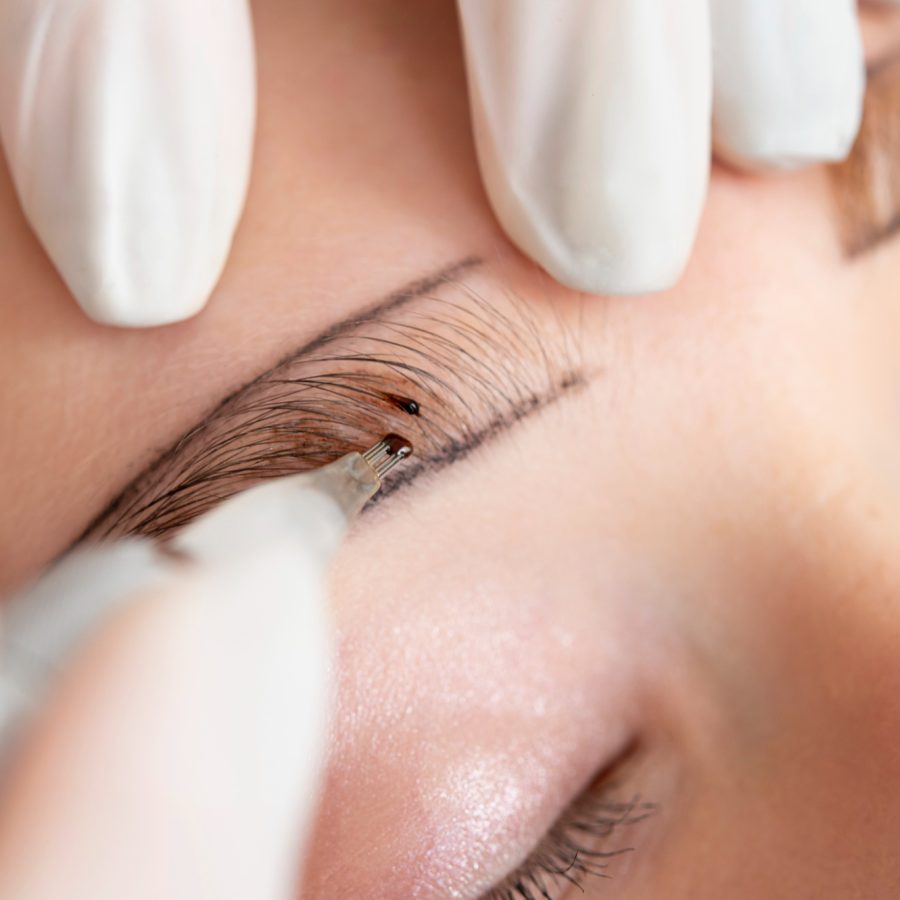 beautician-working-client-s-eyebrows beautician-working-client-s-eyebrows